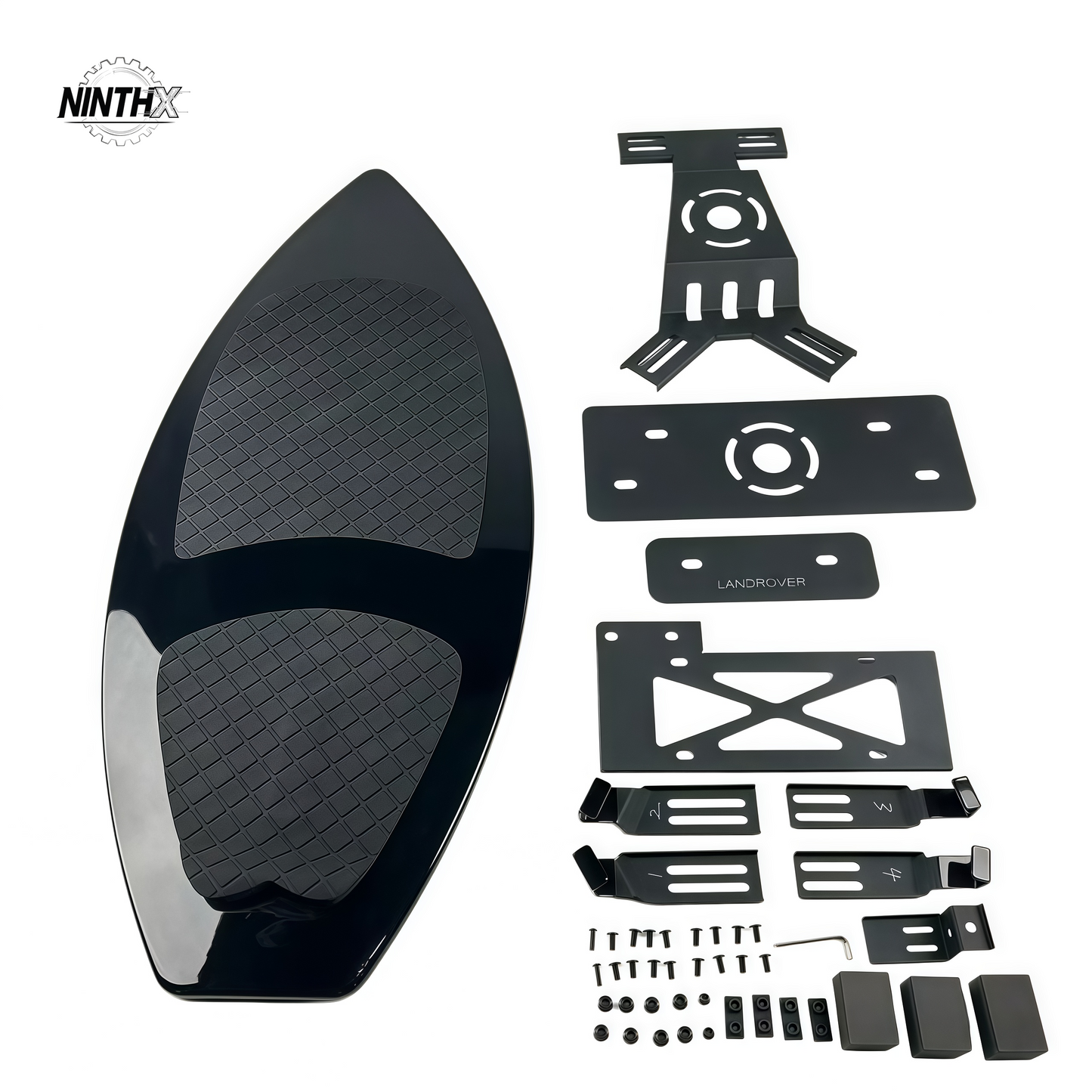 Gloss black surfboard-style spare tire delete panel with textured EVA deck pad and full mounting bracket kit for Land Rover Defender L663