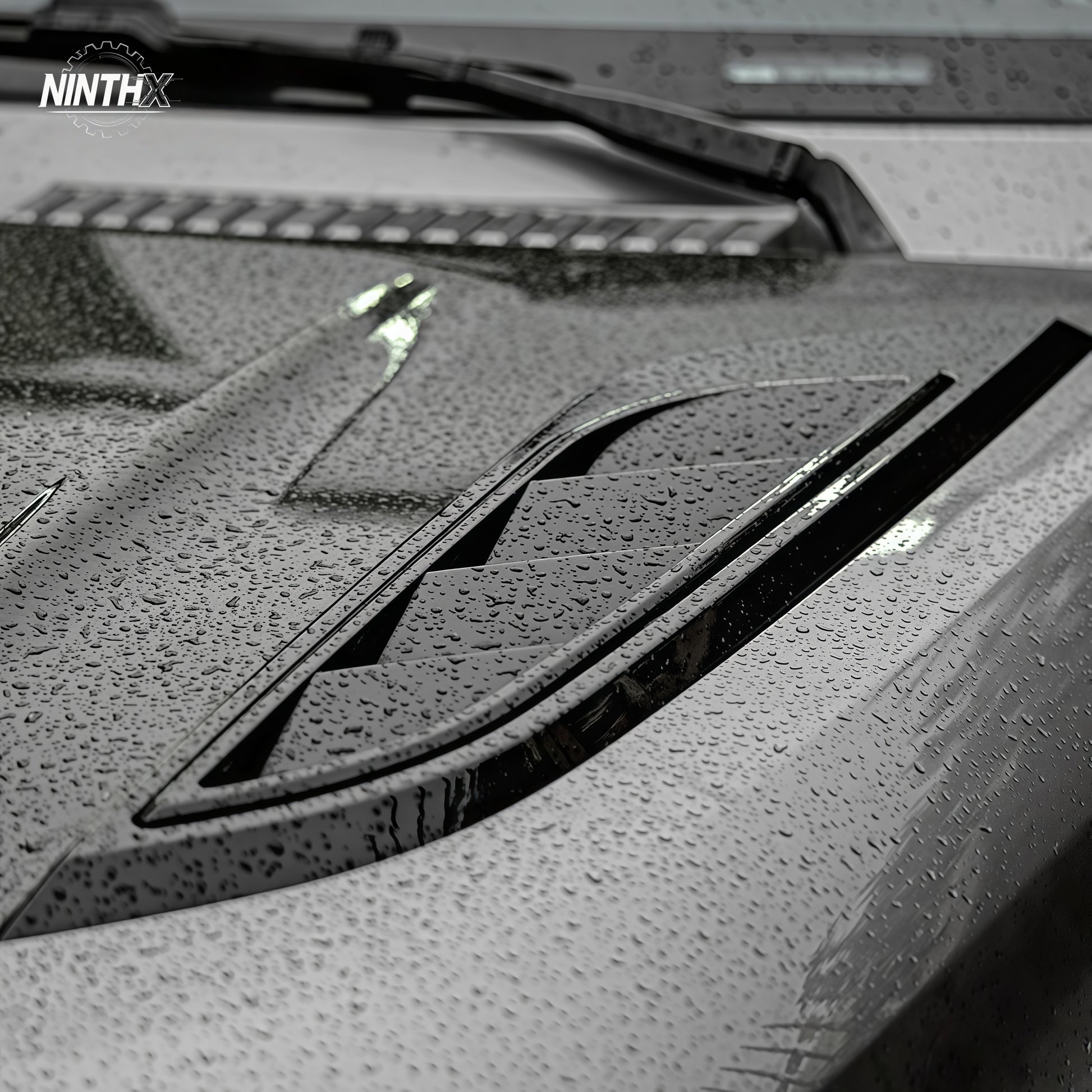 Gloss-black hood air vent grille trim for Defender L663 90/110/130, installed view