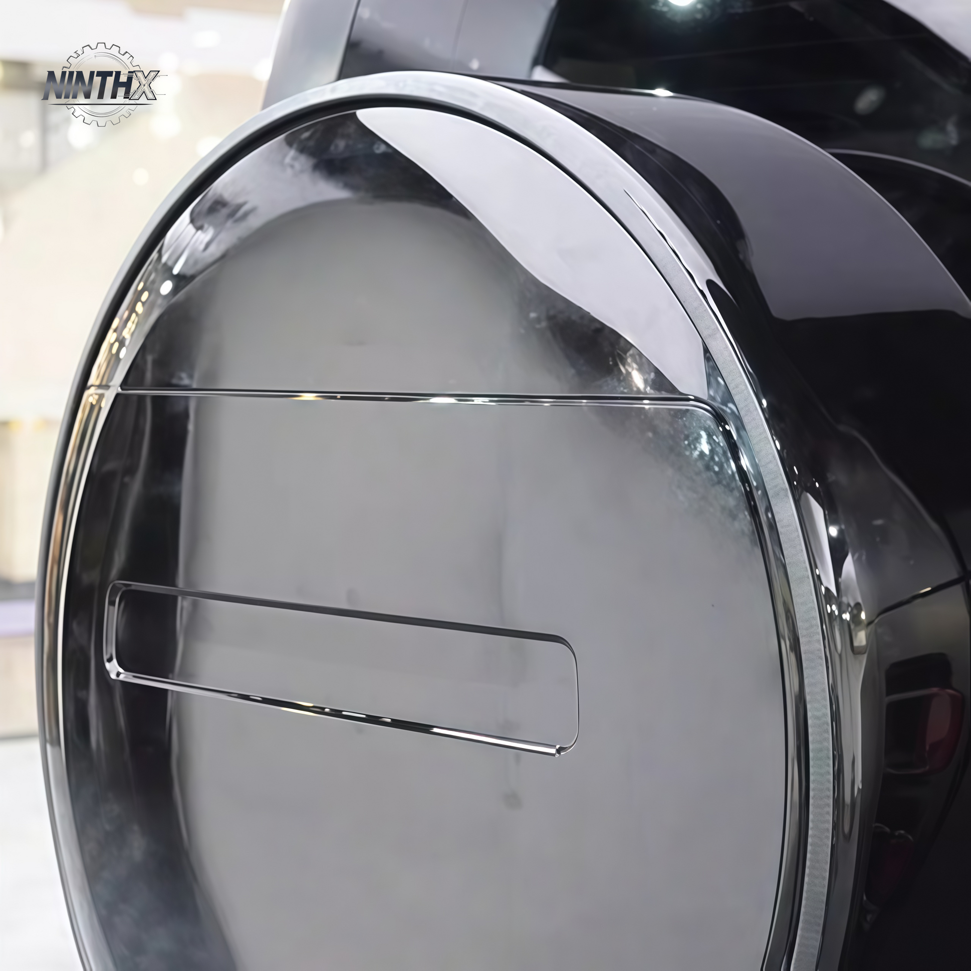 Gloss-black spare tire cover outer ring for Defender L663 90/110/130, installed view