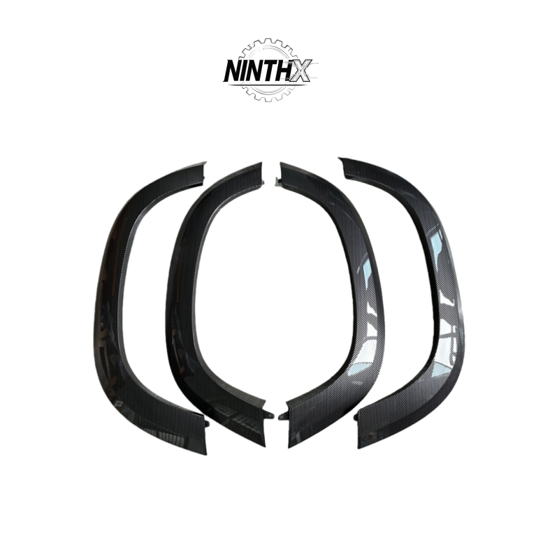 Matte-black off-road mud guard flares, overhead detail view