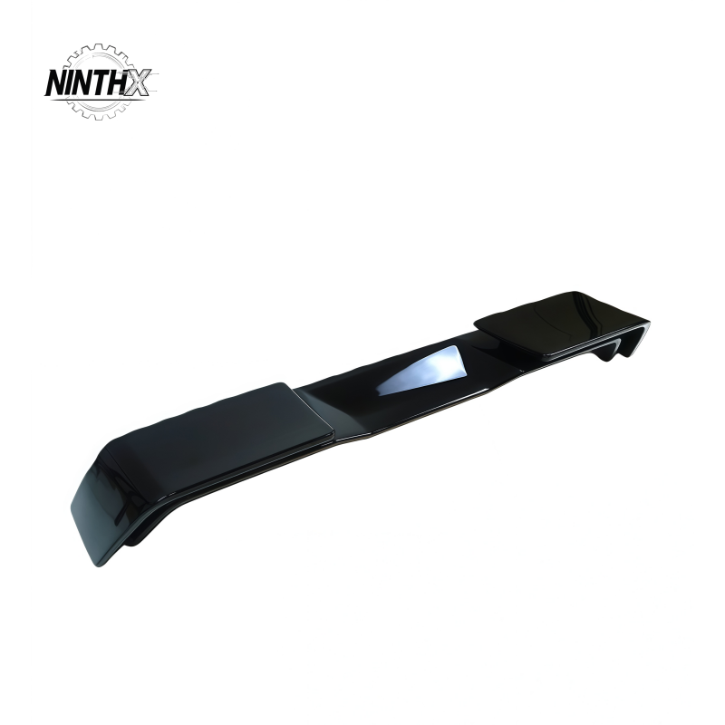 Aerodynamic gloss-black tailgate spoiler, close-up detail