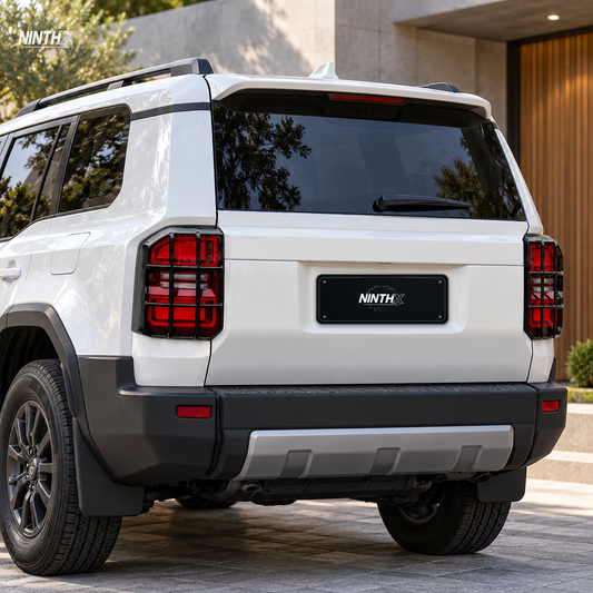 Gloss black tail light guards fitted to the rear lights of a white Toyota Land Cruiser Prado LC250.