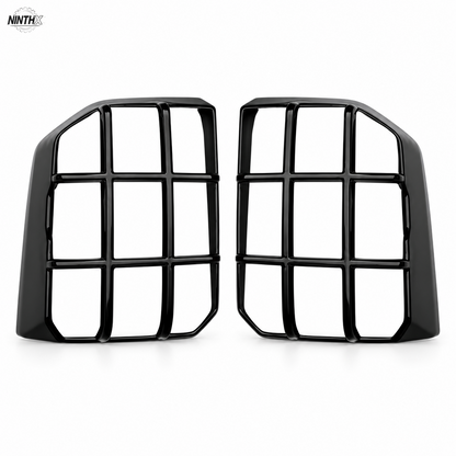 Gloss black tail light guard pair for Toyota Land Cruiser Prado LC250 on a white background.