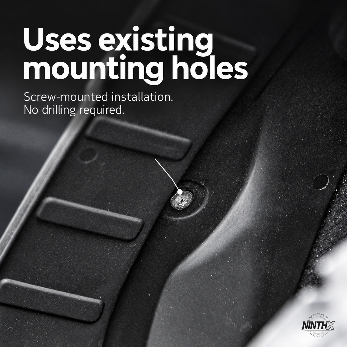 Close-up of the existing screw mounting point on a Prado LC250 rear door inner wheel arch mud guard.