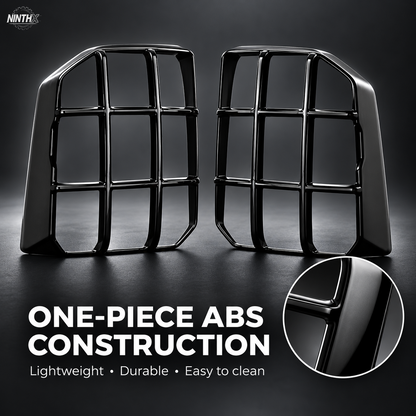 Gloss black ABS Prado LC250 tail light guard pair with a close-up of the molded surface.